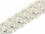 an image of a close up of a bracelet on a white surface