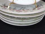 several plates stacked on top of each other on a black table