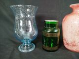 three vases sitting next to each other on a table