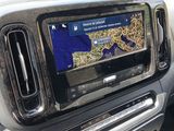a picture of a car dashboard with a map on the screen