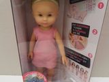 a doll that is in a box on the table