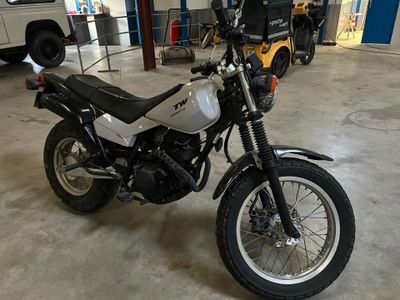 a motorcycle that is parked in a garage