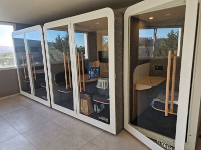 a room with a lot of glass doors that are open
