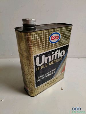 a can of oil that is sitting on a table