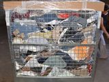 a metal cart with many pairs of shoes in it