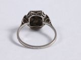 a close up of a ring with a stone in it