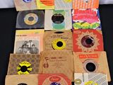 an assortment of various records on a black surface