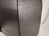 a black box sitting on top of a white surface