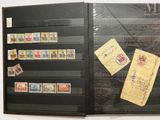 a black folder with a lot of stamps on it