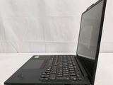 the back of a laptop computer sitting on top of a white table