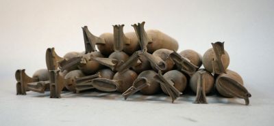 a pile of nuts sitting on the floor next to each other