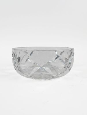 a clear glass bowl sitting on top of a white surface