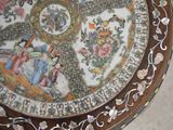 a plate with a picture on it sitting on a table
