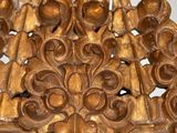 a wooden carving on the wall of a room