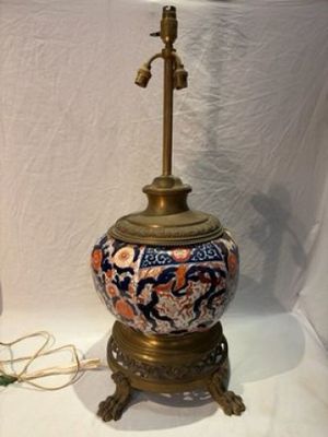 a lamp that is sitting on a table next to a lamp