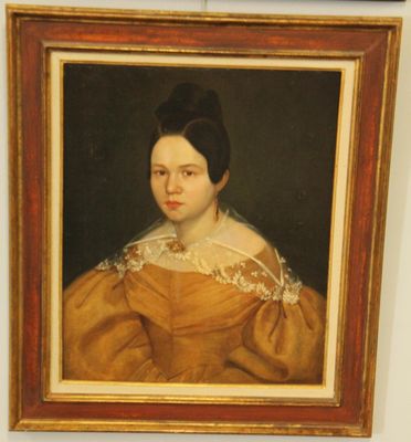 painting of a woman in a yellow dress in a gold dress