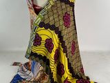a yellow and black scarf on a mannequin mannequin mannequin mannequin mannequin mannequin mannequin mannequin mann