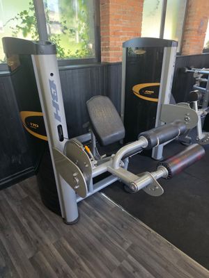 a gym equipment set up in a gym room