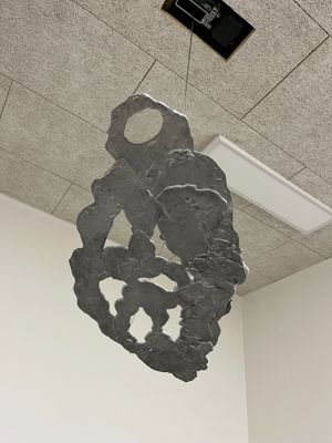a large rock hanging from the ceiling of a room