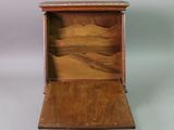 a small wooden box with a drawer inside of it