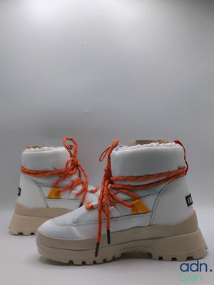 white leather boots with orange laces on a white background