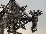 an image of a metal candelab with a candle holder on it