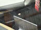 a laptop computer sitting in the back seat of a car