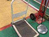 a hand truck and a dolly on the floor in a gym