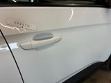 a close up of a car door handle with a sticker on it