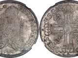 a silver coin with a cross on the front and a cross on the back