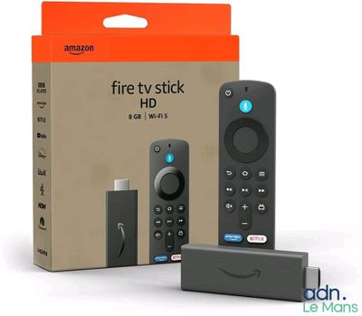 an amazon fire tv stick with a remote in front of it