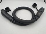 an image of a close up of a black hose on a white surface