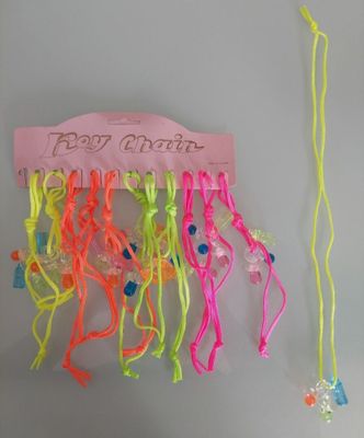 a bunch of neon colored hair ties hanging on a wall