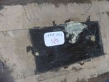 a sign on the side of a brick wall