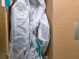 a cardboard box with a plastic bag inside of it