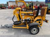 an image of a small machine that is parked in a parking lot
