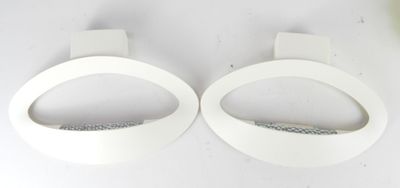 two pieces of white paper on a white surface