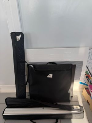 a laptop and a case sitting on the floor next to each other