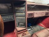 a car dashboard with a steering wheel and a dash board