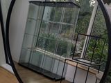 a mirror that is sitting on a window sill