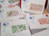 many pieces of paper that are sitting on a table