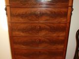 an image of a dresser in a room with a chair
