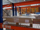 a lot of boxes on the shelves in the warehouse
