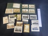 a lot of old photographs on the table