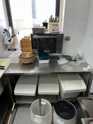 a picture of a kitchen with a lot of food on the counter