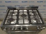 a stainless steel stove top with four burners and four burners