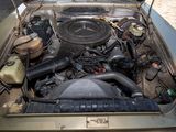 a car engine with the hood up and the hood down