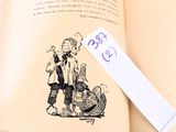 a book with a drawing of a boy and a cat on it