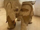 a statue of an elephant that is standing on the floor