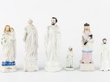 a group of figurines of people that are standing together
